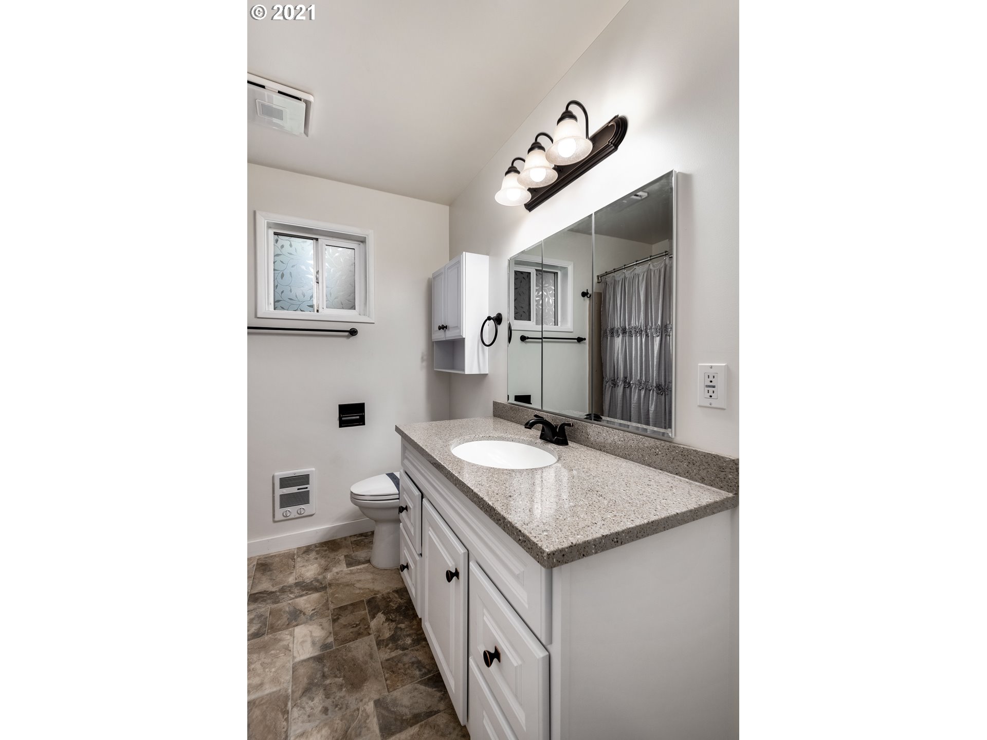 84832 Edenvale Road Pleasant Hill, OR 97455 - Photo 9 of 32 a bathroom with a granite countertop sink and a mirror