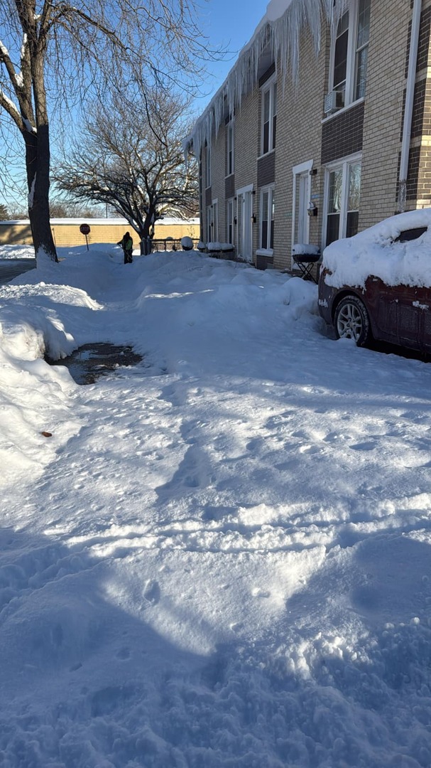 2204 Hebron Avenue, Unit B Zion, IL 60099 - Photo 13 of 13 a view of building with car parked
