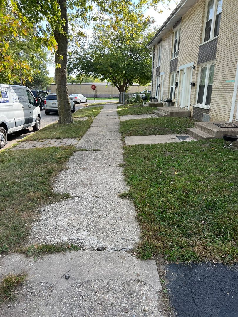 2204 Hebron Avenue, Unit B Zion, IL 60099 - Photo 8 of 13 a view of a park with cars parked in front of it