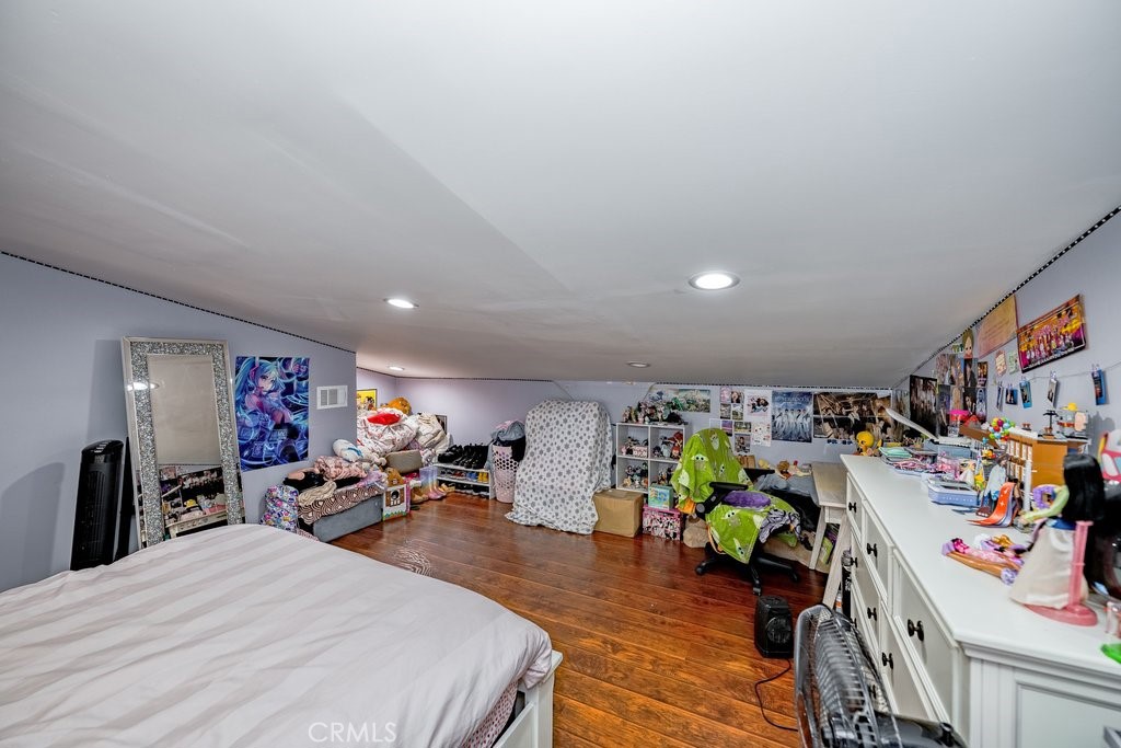 6834 Quinton Lane Tujunga, CA 91042 - Photo 14 of 22 a bed room with a bed and a large mirror
