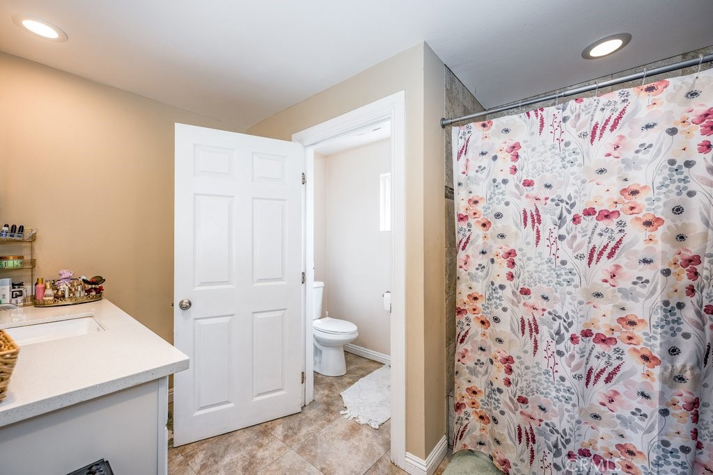 6834 Quinton Lane Tujunga, CA 91042 - Photo 17 of 22 a bathroom with a sink toilet and shower