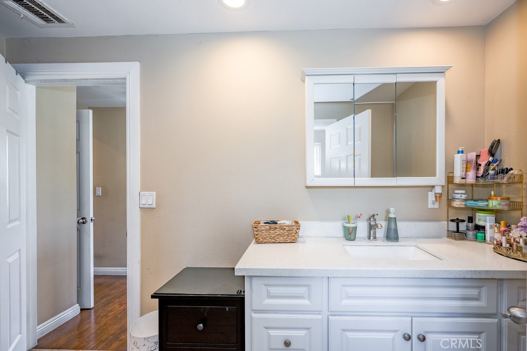 6834 Quinton Lane Tujunga, CA 91042 - Photo 18 of 22 a bathroom with a sink and a mirror