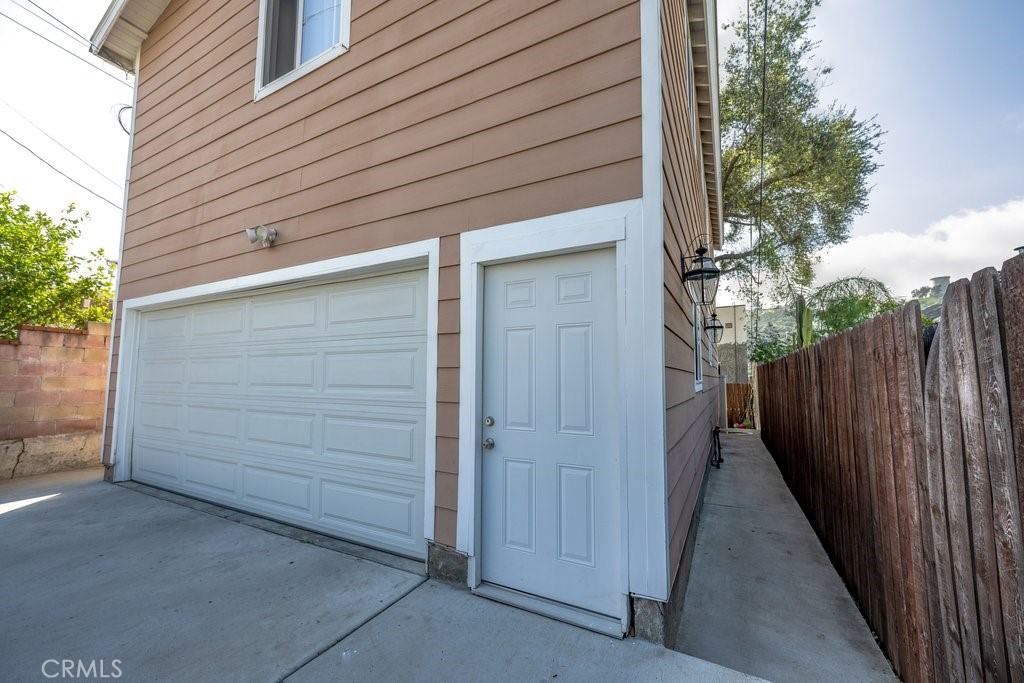 6834 Quinton Lane Tujunga, CA 91042 - Photo 4 of 22 a view of house with backyard and wooden fence