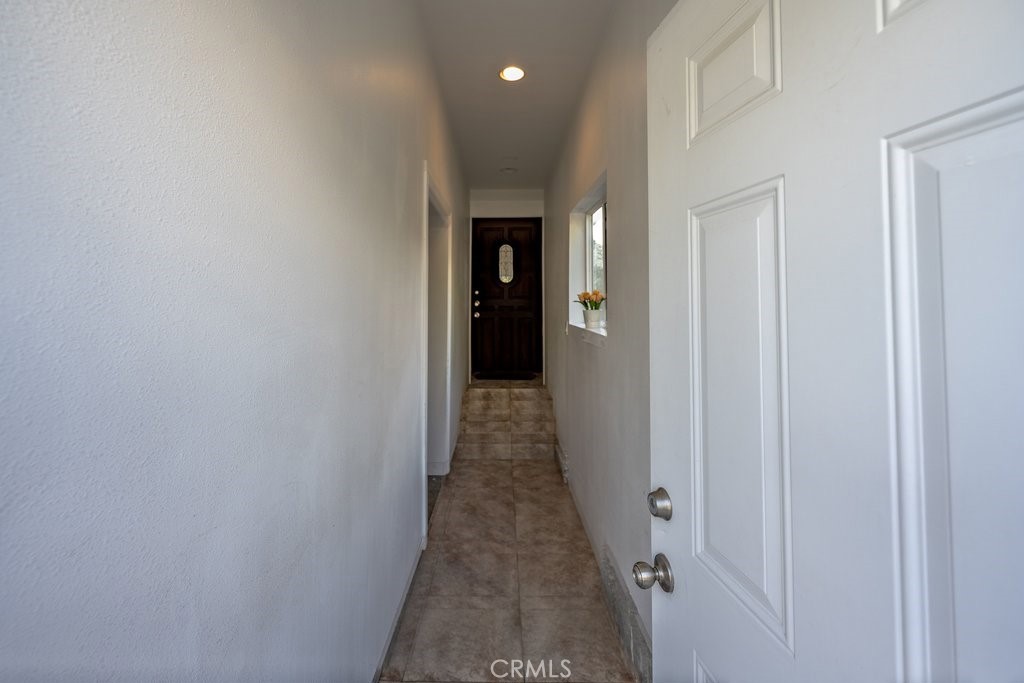 6834 Quinton Lane Tujunga, CA 91042 - Photo 5 of 22 a view of a hallway with wooden floor