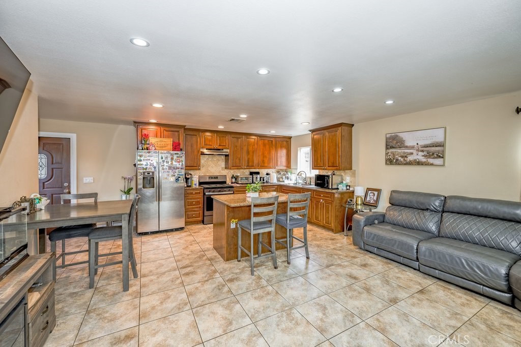6834 Quinton Lane Tujunga, CA 91042 - Photo 6 of 22 a living room with lots of furniture and kitchen view