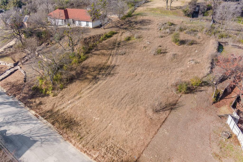 304 Willow Ridge Court Fort Worth, TX 76103 - Photo 19 of 22 a view of a dry yard with wooden fence