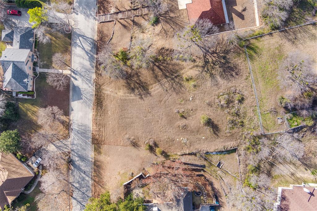 304 Willow Ridge Court Fort Worth, TX 76103 - Photo 22 of 22 a view of a dry yard with wooden fence