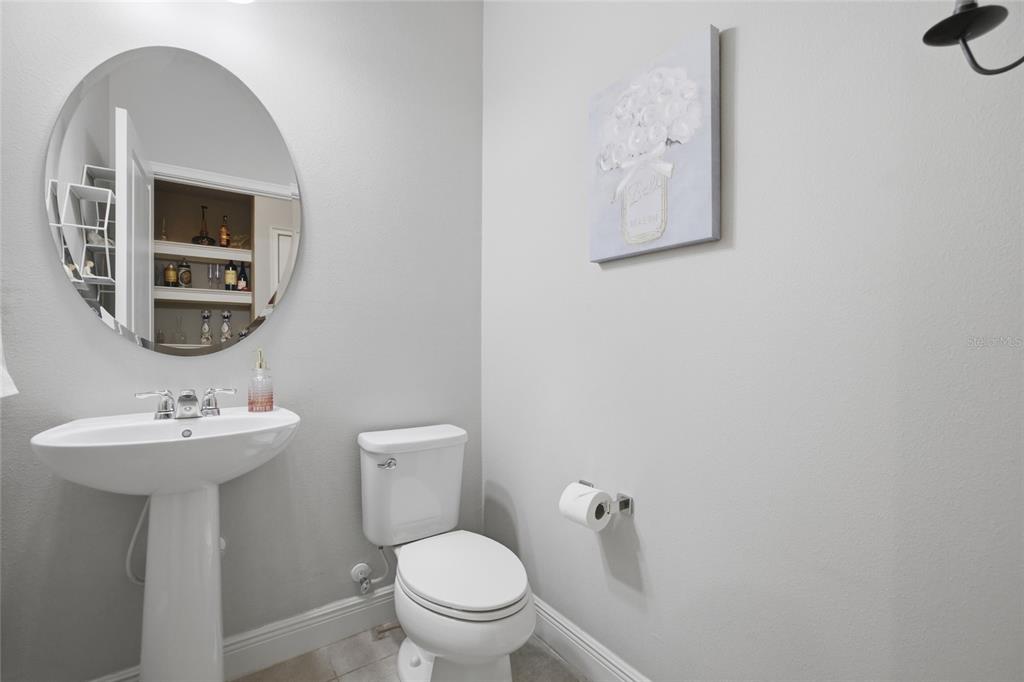 2013 Sunset Wind Loop Oldsmar, FL 34677 - Photo 11 of 43 a bathroom with a toilet sink and mirror
