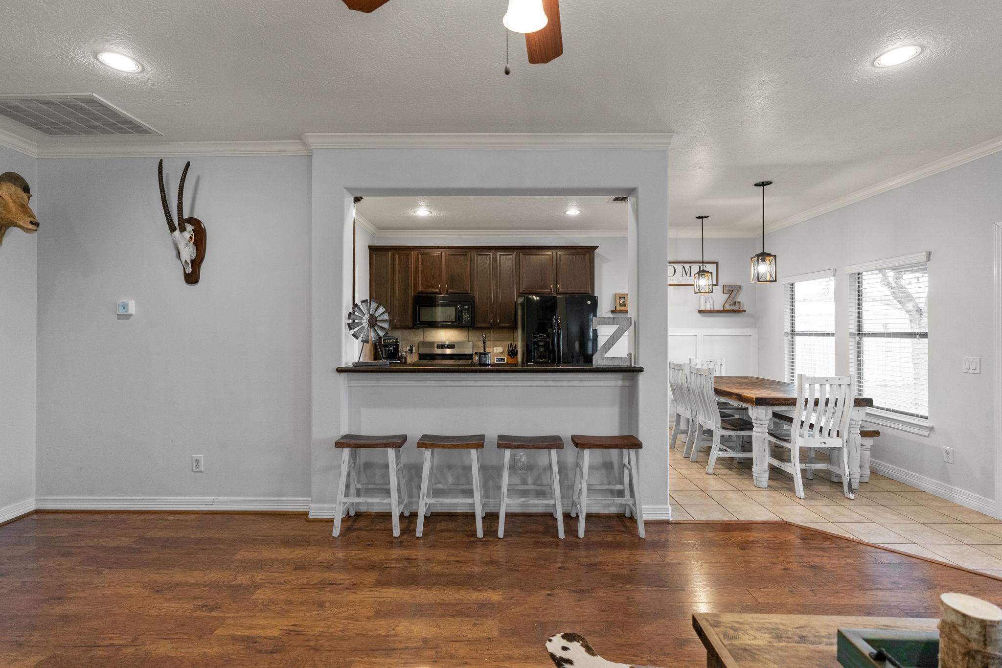 5942 Wildflower Road Sealy, TX 77474 - Photo 8 of 41 a view of a dining room with furniture and wooden floor