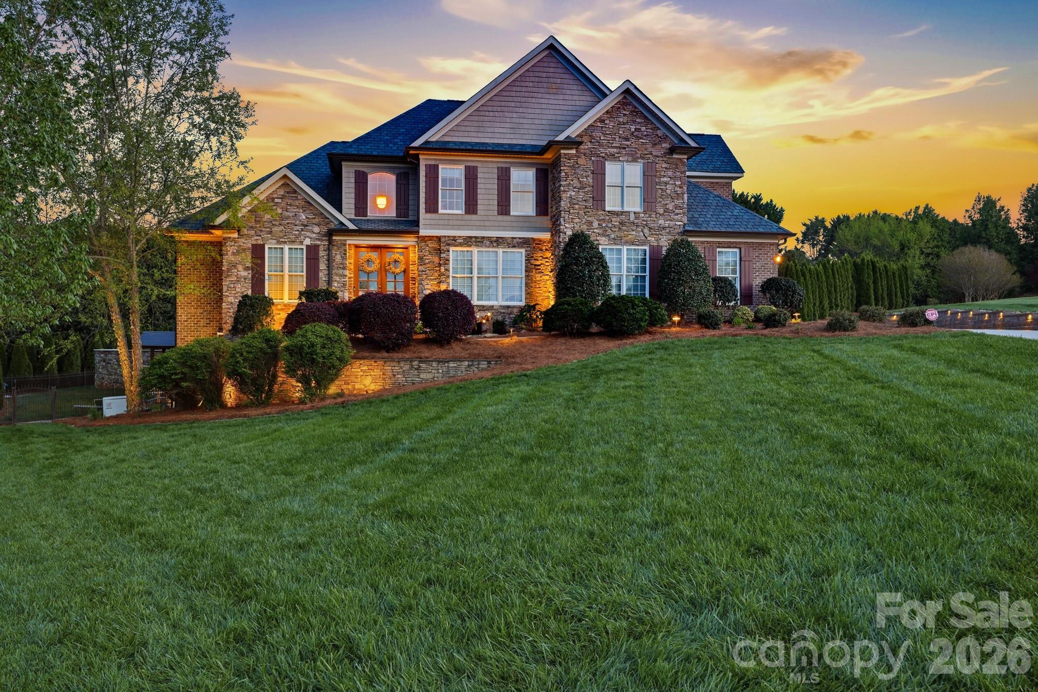 3638 Hogan Court Conover, NC 28613 - Photo 3 of 38 a front view of a house with a yard and trees
