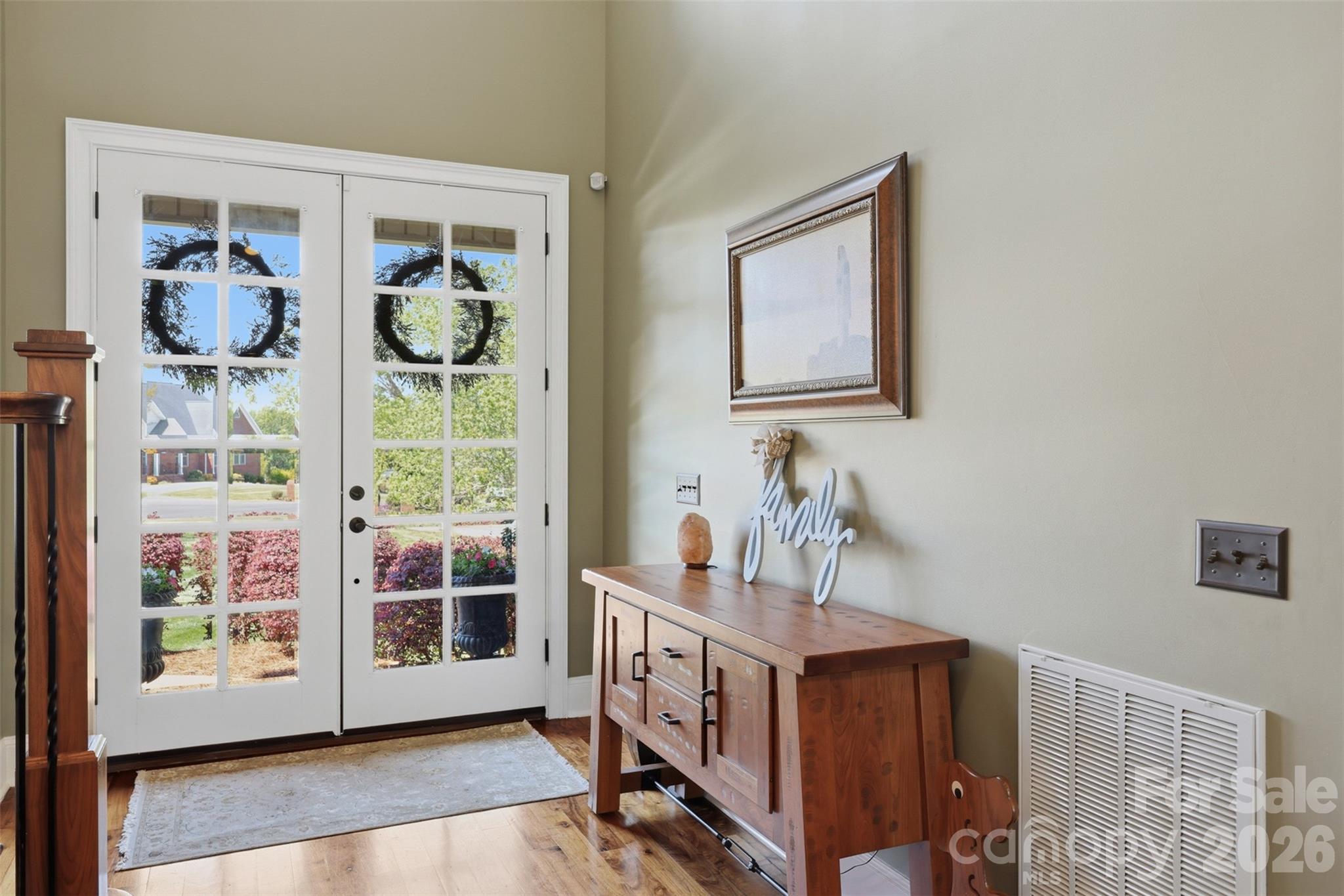 3638 Hogan Court Conover, NC 28613 - Photo 9 of 38 a view of an entryway with wooden floor and windows