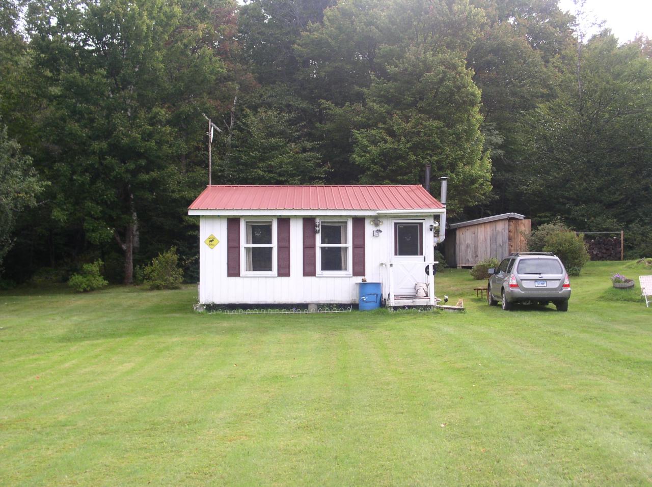Lot #5 Risky Ranch Road Stamford, VT 05352 - Photo 2 of 4 a front view of a house with garden