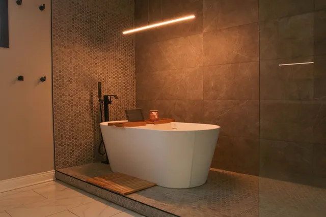 a white bath tub sitting in a bathroom
