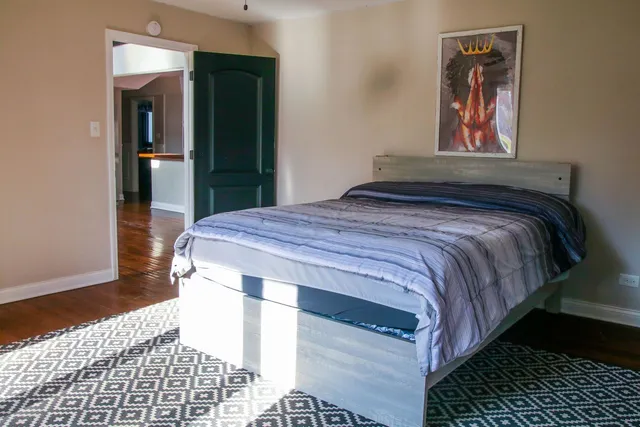 a bedroom with a bed and cabinets