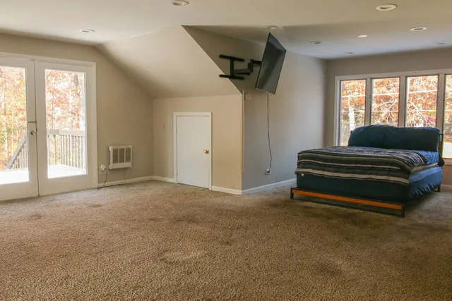 a view of a livingroom with furniture and windows