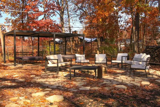 a view of a patio with chairs and tables