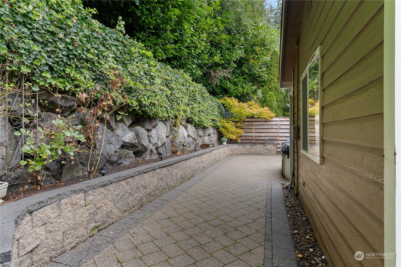 2409 208th Place Southeast Bothell, WA 98021 - Photo 17 of 18 a view of a garden with an outdoor seating