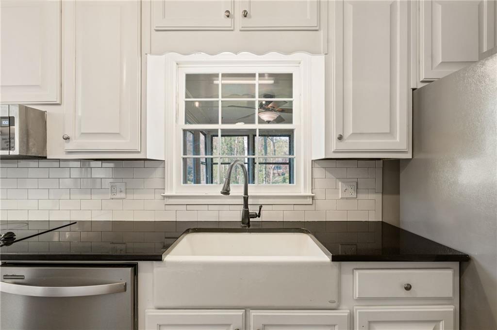 835 Lockriver Way Lawrenceville, GA 30044 - Photo 11 of 68 a kitchen with a sink and cabinets