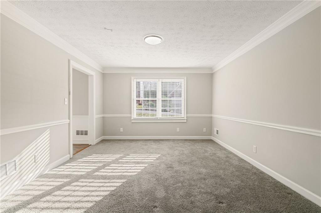 835 Lockriver Way Lawrenceville, GA 30044 - Photo 19 of 68 a view of an empty room with a window