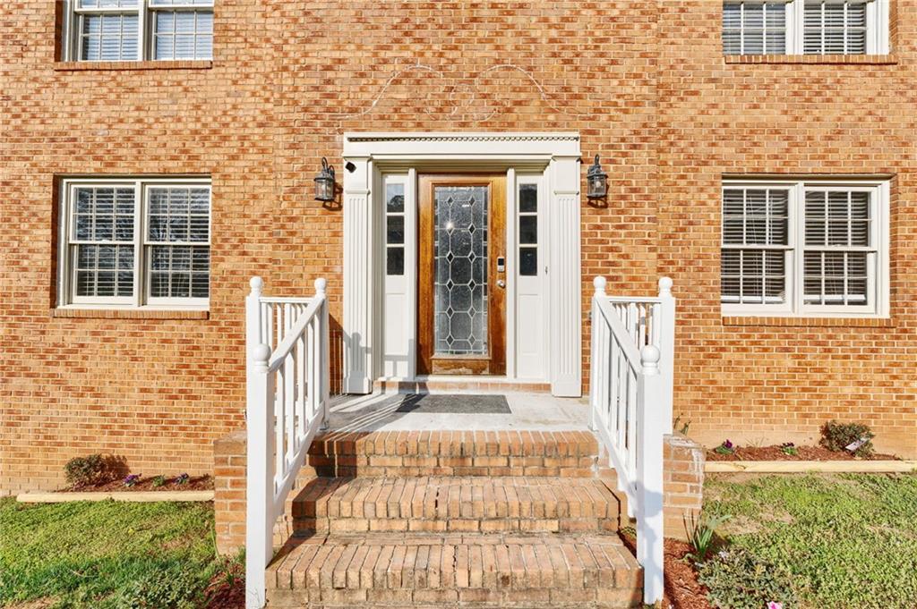 835 Lockriver Way Lawrenceville, GA 30044 - Photo 2 of 68 a front view of a house with a yard