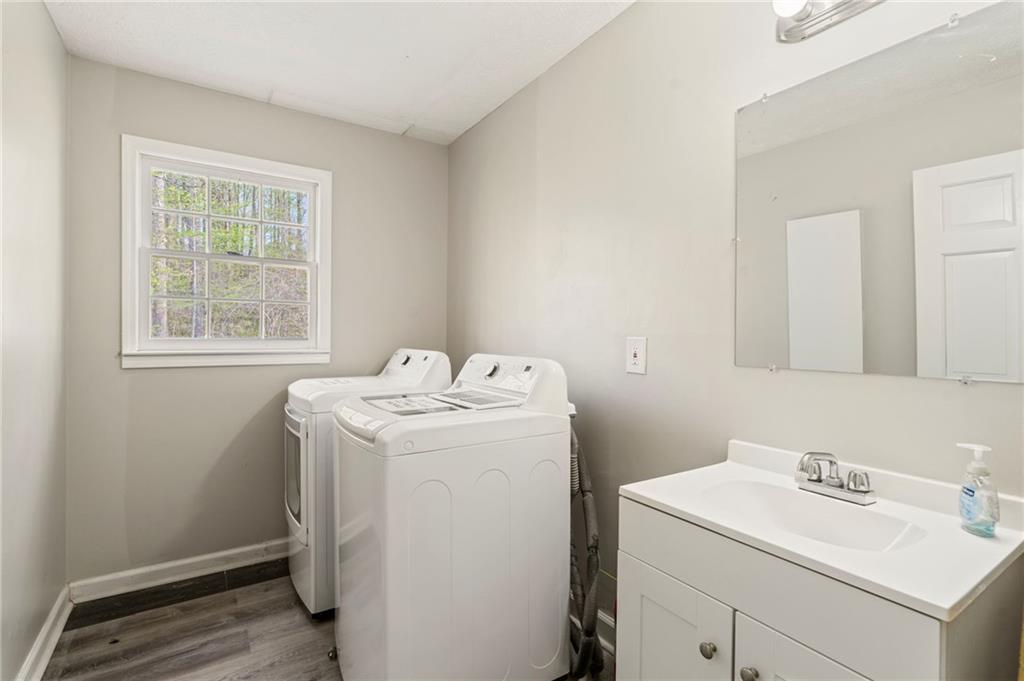 835 Lockriver Way Lawrenceville, GA 30044 - Photo 31 of 68 a utility room with dryer and washer