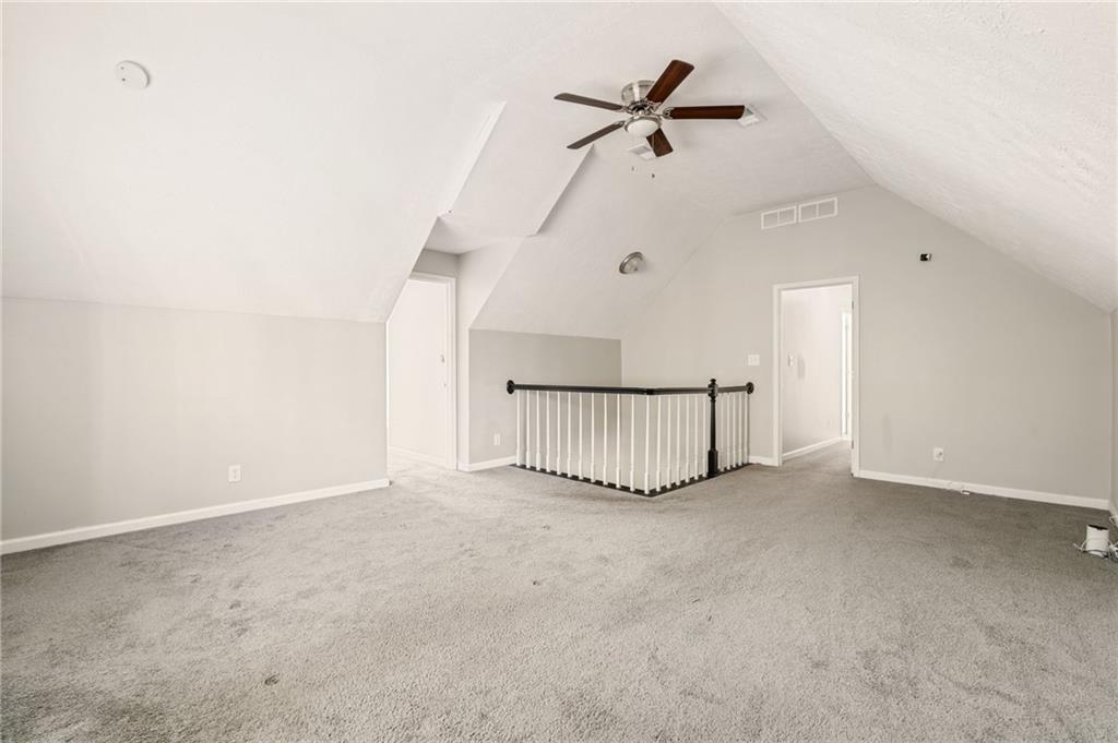 835 Lockriver Way Lawrenceville, GA 30044 - Photo 34 of 68 a view of a livingroom with a ceiling fan and window