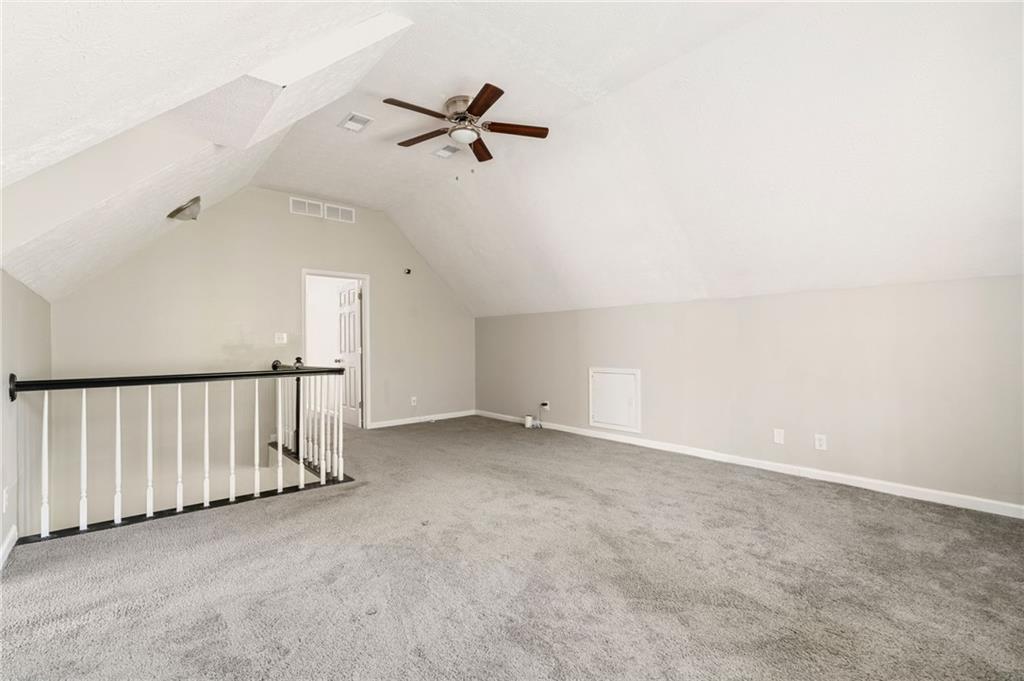 835 Lockriver Way Lawrenceville, GA 30044 - Photo 35 of 68 an empty room with a ceiling fan and wooden floor