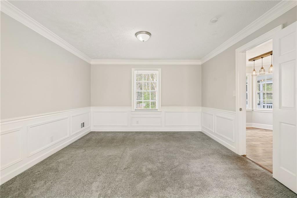 835 Lockriver Way Lawrenceville, GA 30044 - Photo 36 of 68 wooden floor in an empty room with a window