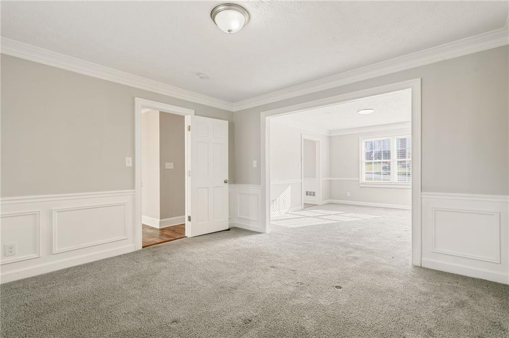 835 Lockriver Way Lawrenceville, GA 30044 - Photo 37 of 68 an empty room with a empty space and windows