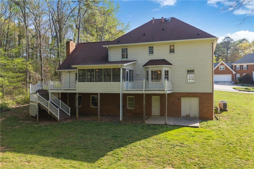 835 Lockriver Way Lawrenceville, GA 30044 - Photo 48 of 68 a front view of a house with a yard