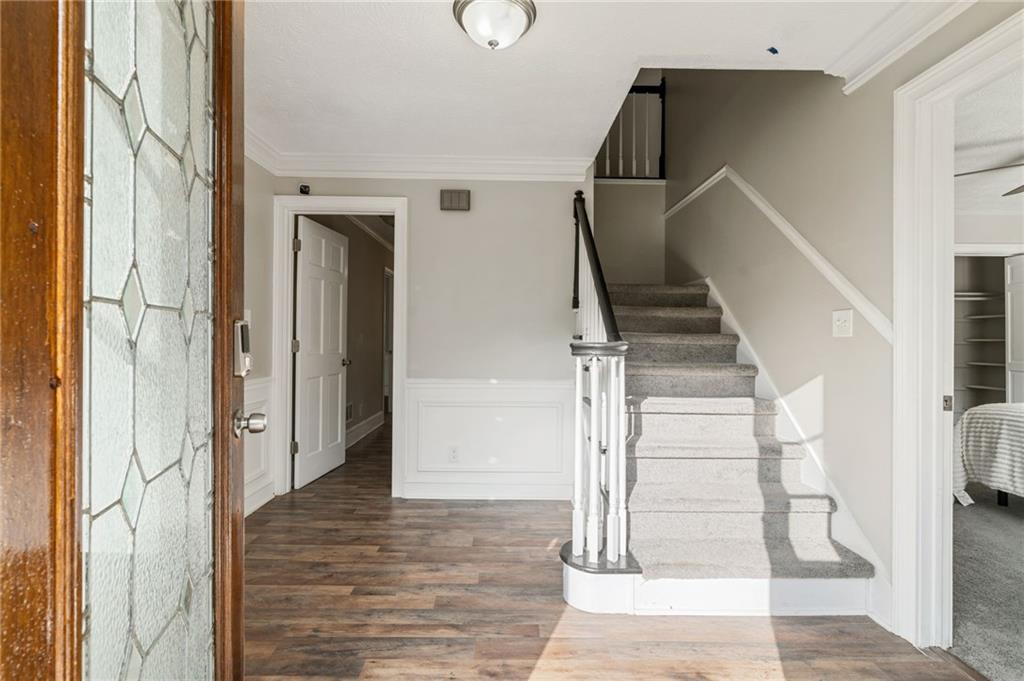 835 Lockriver Way Lawrenceville, GA 30044 - Photo 5 of 68 a view of entryway and hall with wooden floor