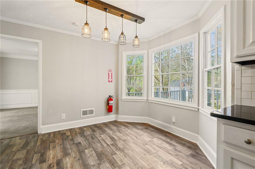 835 Lockriver Way Lawrenceville, GA 30044 - Photo 6 of 68 a view of an empty room with a window