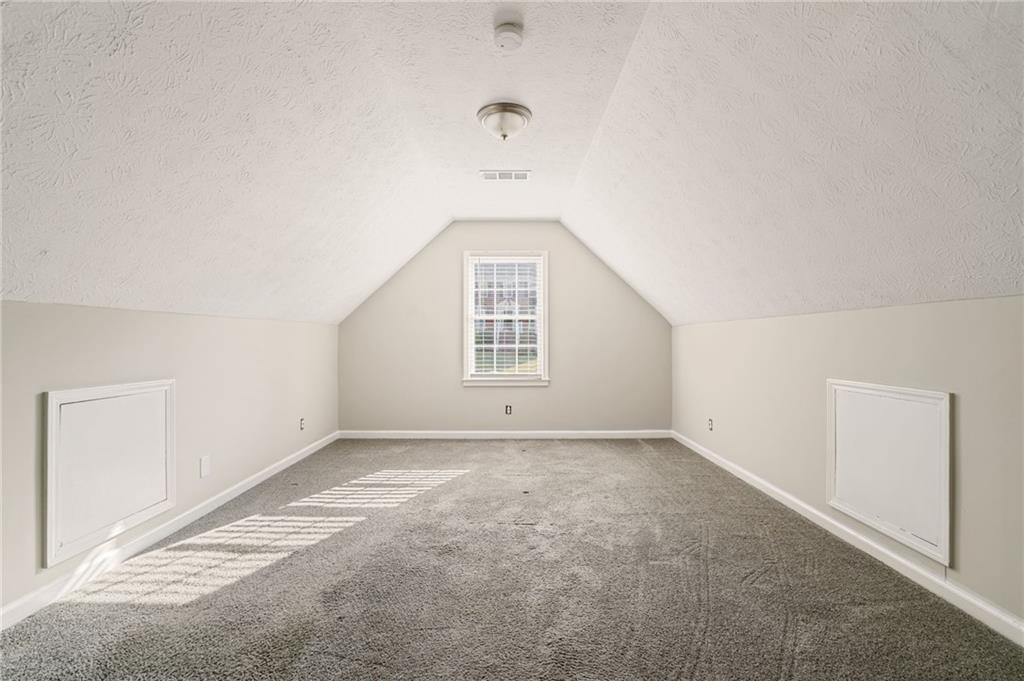 835 Lockriver Way Lawrenceville, GA 30044 - Photo 63 of 68 an empty room with windows