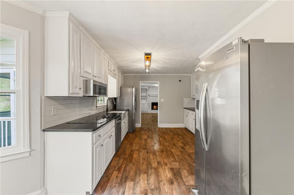 835 Lockriver Way Lawrenceville, GA 30044 - Photo 9 of 68 a kitchen with stainless steel appliances granite countertop a refrigerator and a sink
