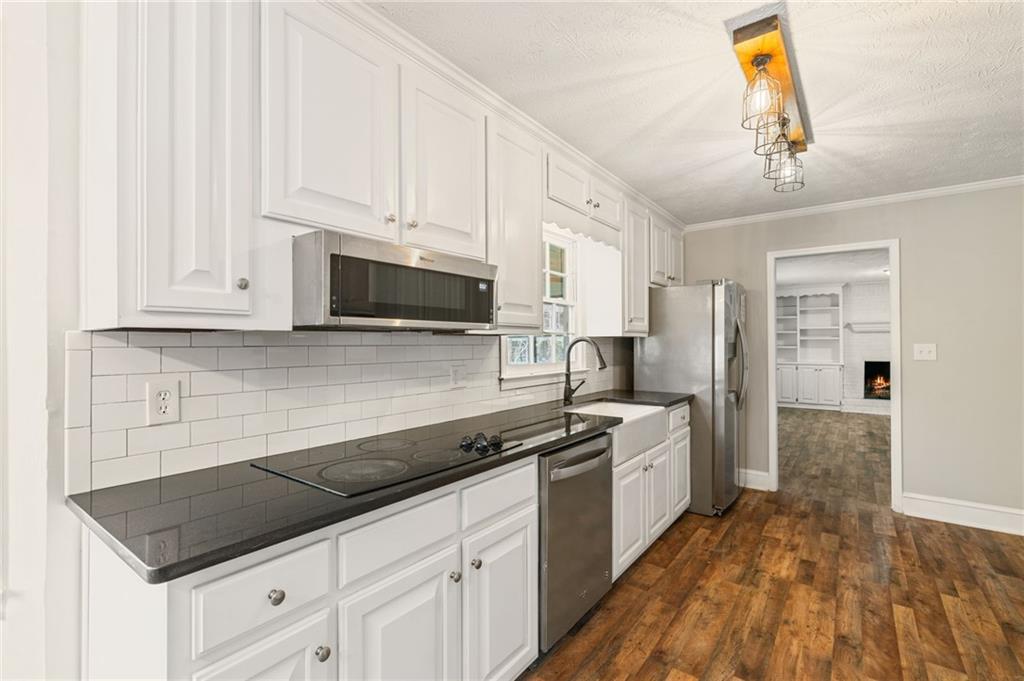 835 Lockriver Way Lawrenceville, GA 30044 - Photo 10 of 68 a kitchen with stainless steel appliances a stove a sink and a refrigerator