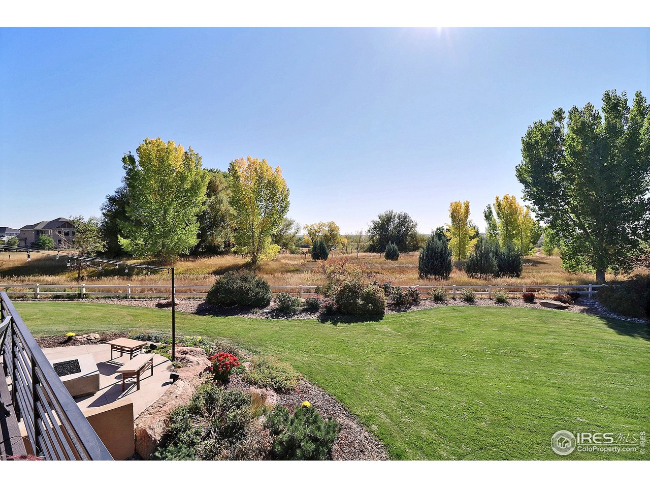 6320 Westchase Road Fort Collins, CO 80528 - Photo 39 of 40 Backyard opens up to walking path and Fossil Creek Reservoir with scenic views of the front Range.