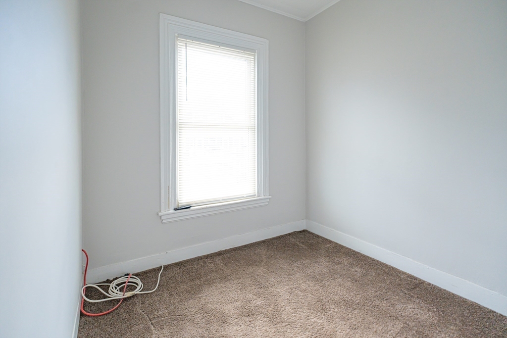 131 Summer Street, Unit 2 Somerville, MA 02143 - Photo 15 of 15 an empty room with a window