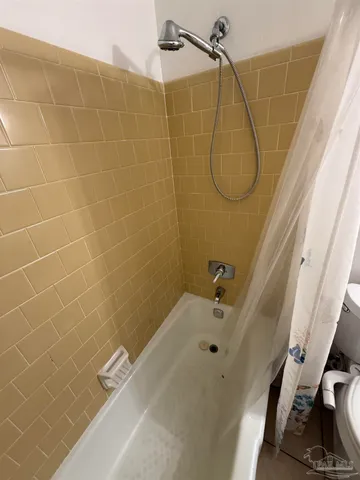 a view of a bathroom with a sink and a mirror
