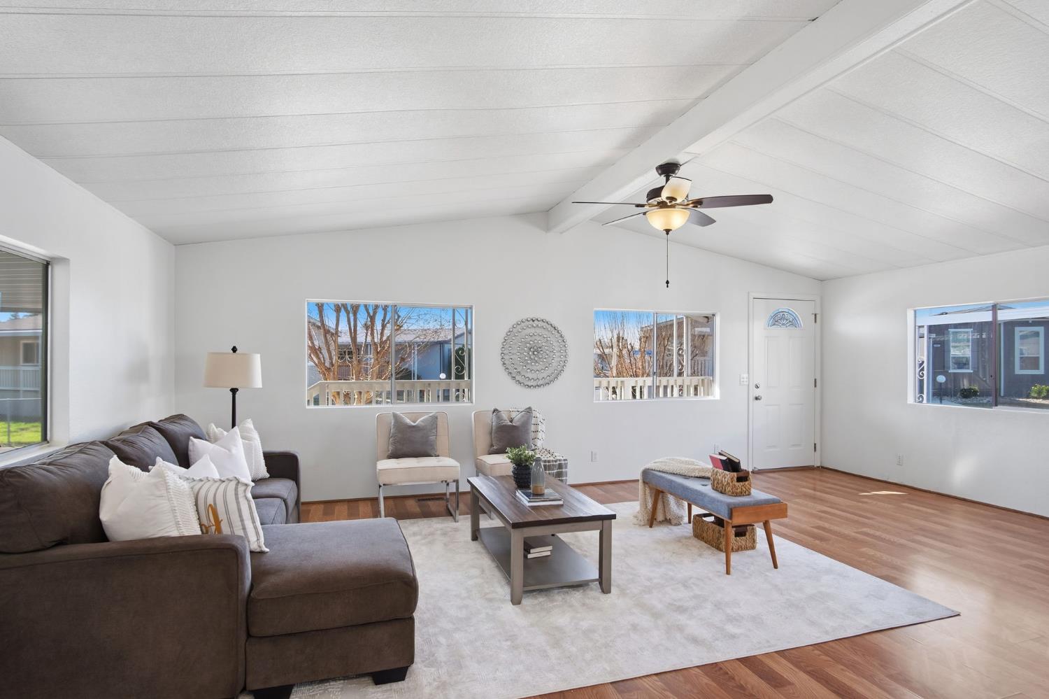 1428 Playground Way Modesto, CA 95355 - Photo 17 of 29 a living room with furniture a chandelier and a window