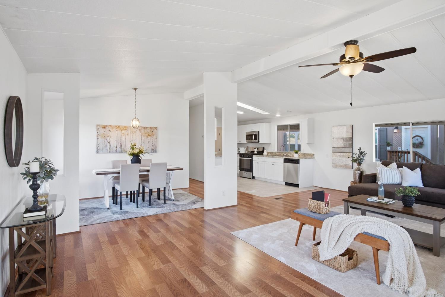 1428 Playground Way Modesto, CA 95355 - Photo 19 of 29 a living room with furniture and kitchen view