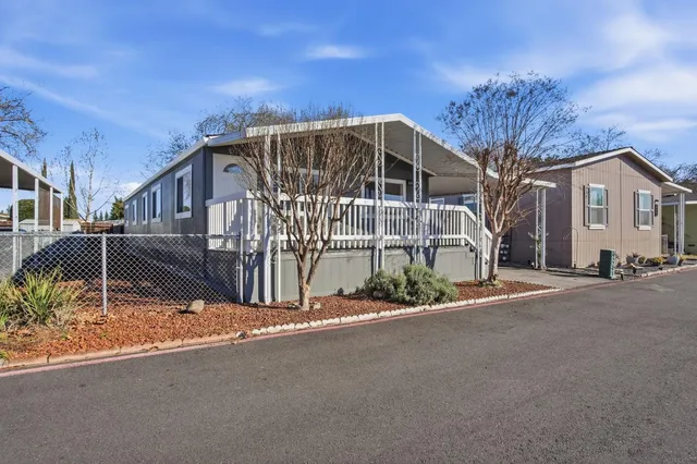 a view of a house with a street