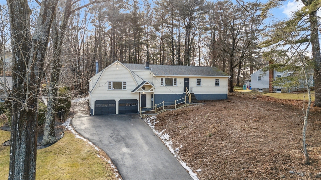 62 Cedar Hill Road Ashland, MA 01721 - Photo 2 of 11 front view of a house with a yard
