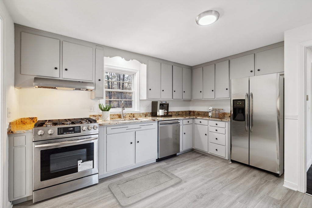 62 Cedar Hill Road Ashland, MA 01721 - Photo 3 of 11 a kitchen with cabinets appliances and wooden floor