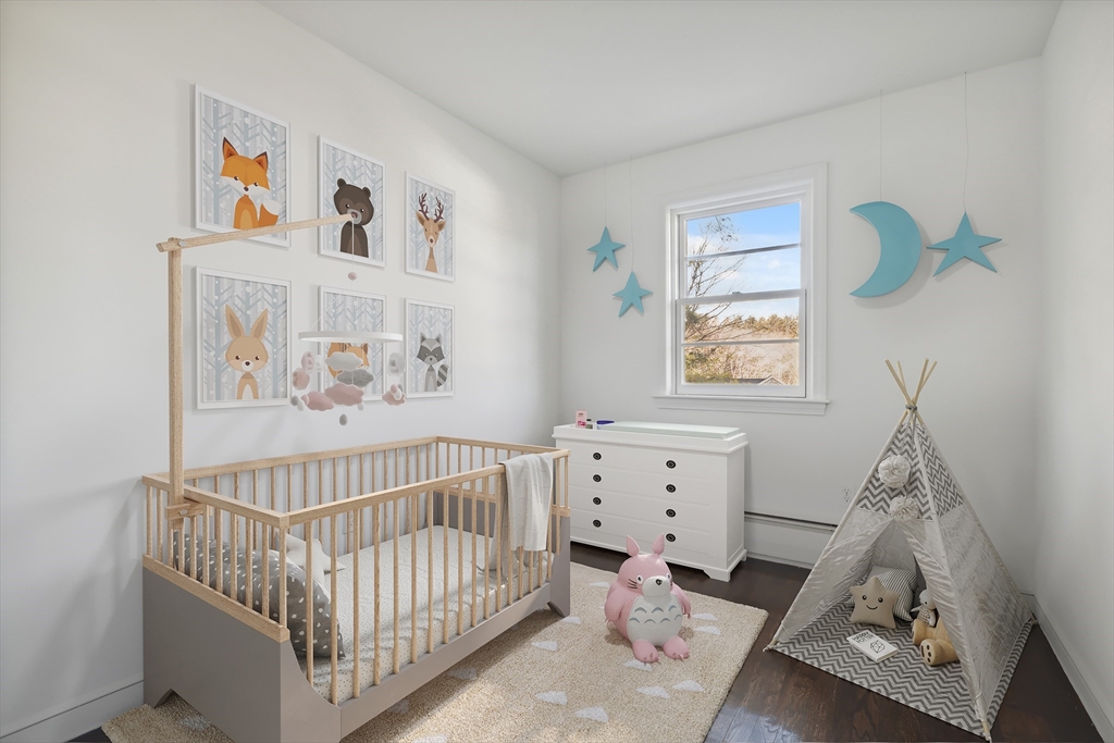 62 Cedar Hill Road Ashland, MA 01721 - Photo 8 of 11 a bedroom with baby crib and window