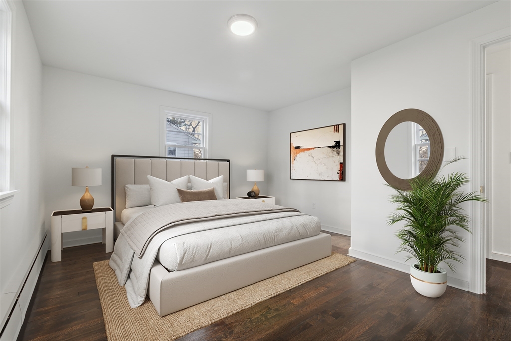 62 Cedar Hill Road Ashland, MA 01721 - Photo 9 of 11 a bedroom with a bed and a potted plant