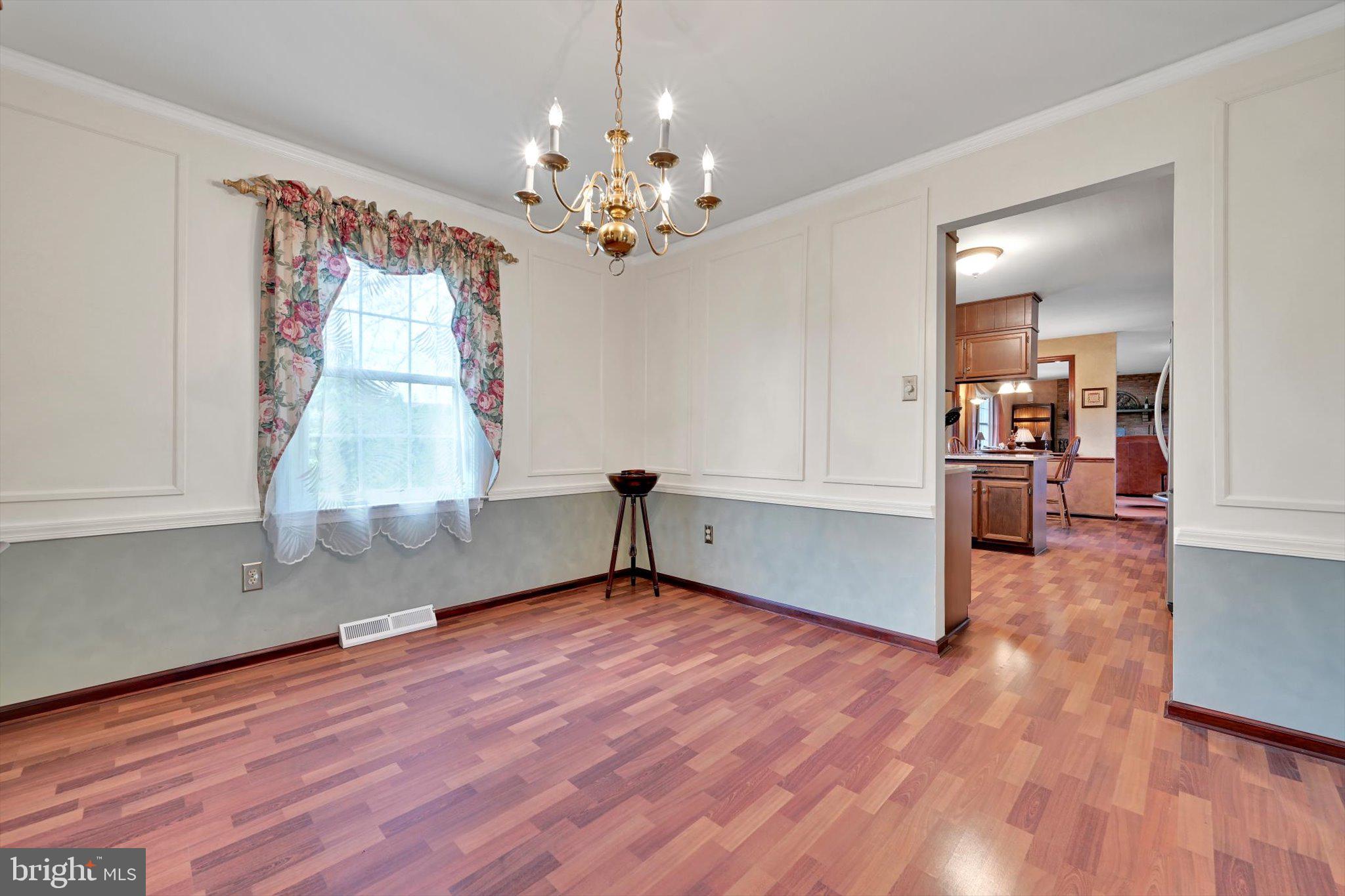 1546 Singer Road Wyomissing, PA 19610 - Photo 12 of 40 a view of empty room with wooden floor and fan