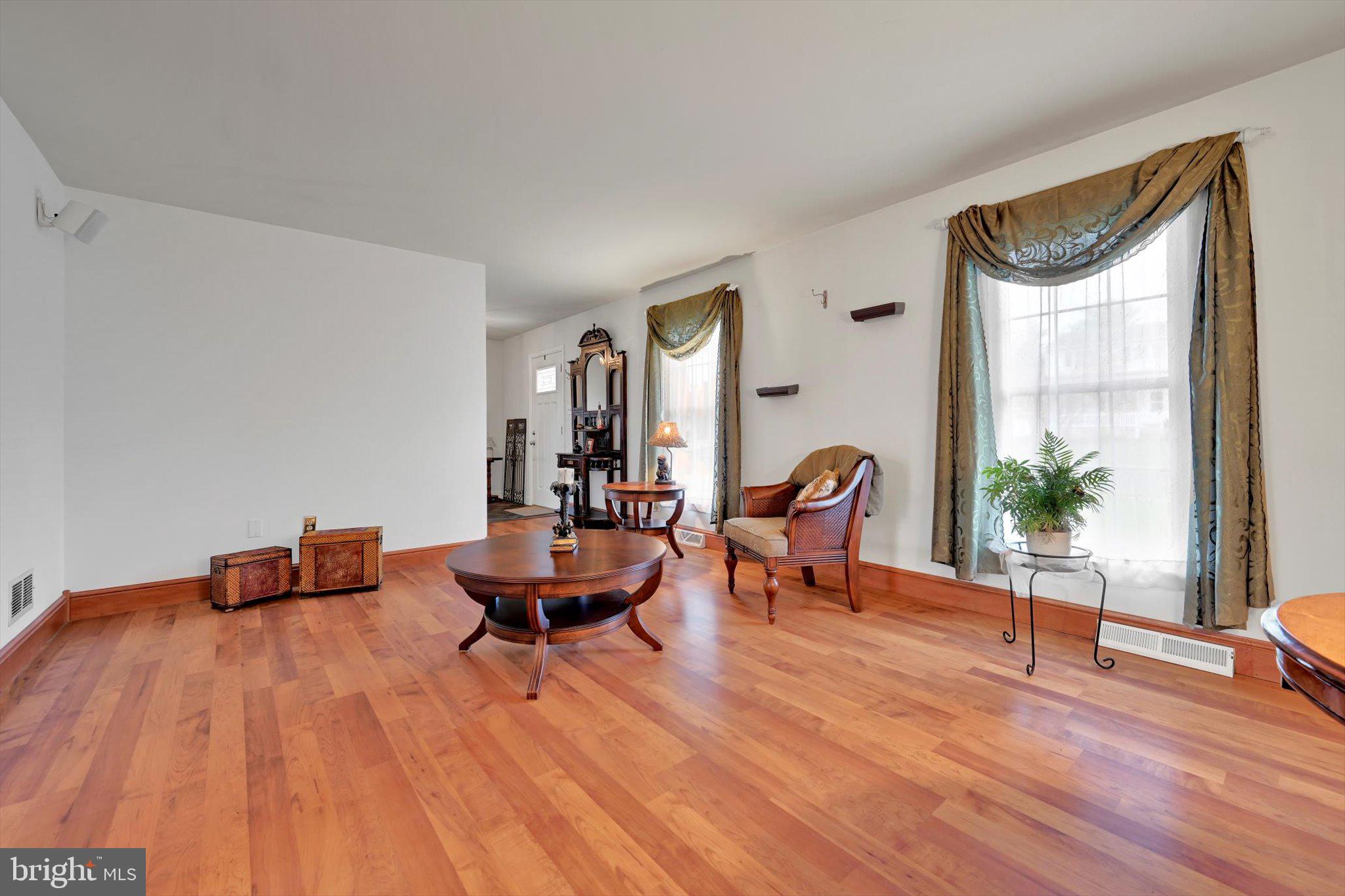 1546 Singer Road Wyomissing, PA 19610 - Photo 14 of 40 a living room with furniture and a potted plant