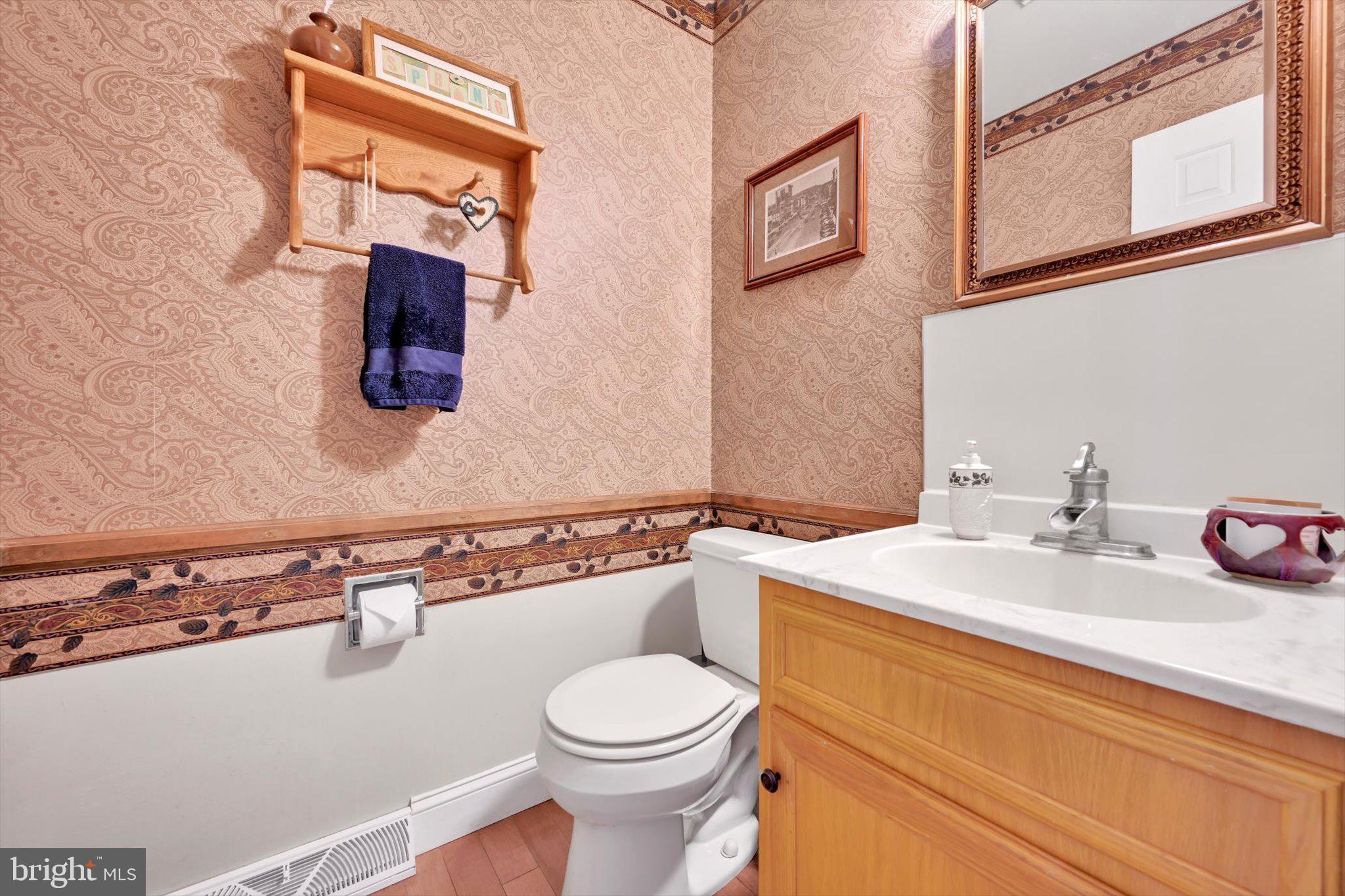 1546 Singer Road Wyomissing, PA 19610 - Photo 15 of 40 a bathroom with a sink a toilet and mirror
