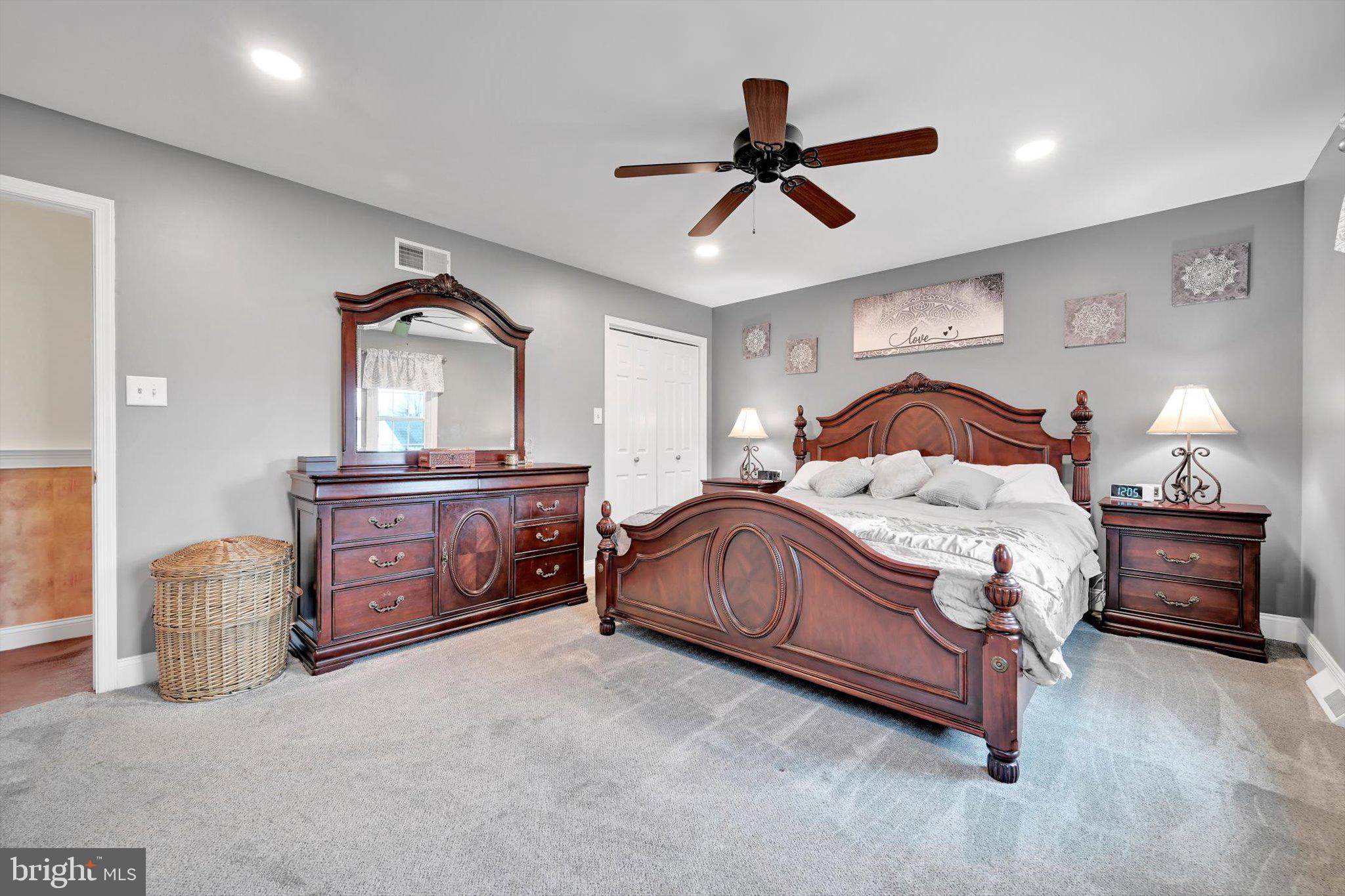 1546 Singer Road Wyomissing, PA 19610 - Photo 16 of 40 a bedroom with a bed and a dresser
