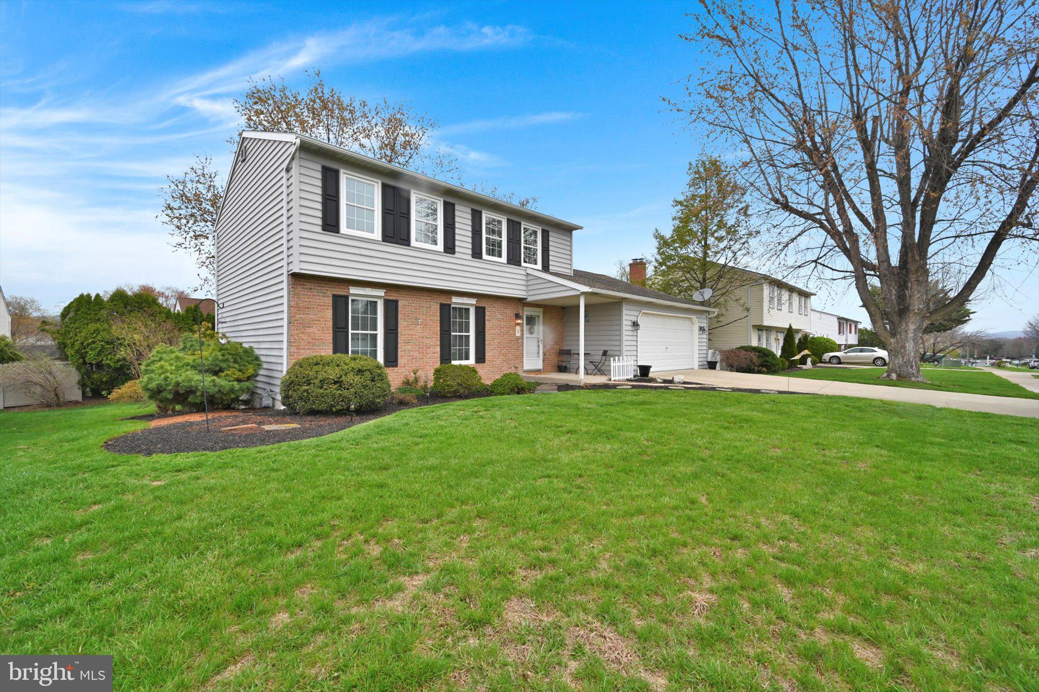1546 Singer Road Wyomissing, PA 19610 - Photo 35 of 40 a front view of a house with a yard